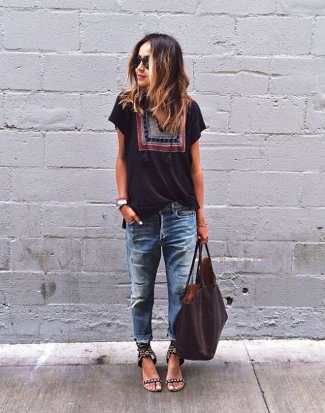 black tribal t-shirt with heavily ripped and washed boyfriend jeans