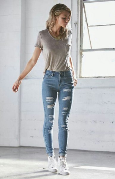 gray t-shirt with blue high skinny cuffed jeans