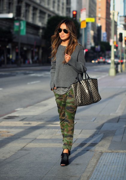 gray knitted sweater with camo straight leg jeans and black ballet flats