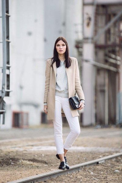 blush pink long wool coat with cuffed white jeans