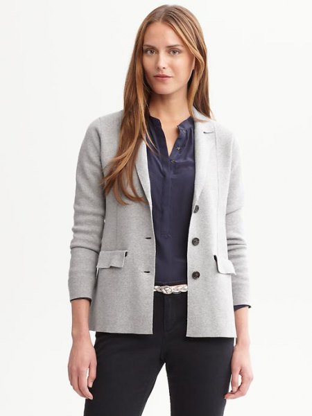light gray sweater-blazer with dark blue collar-free button up shirt