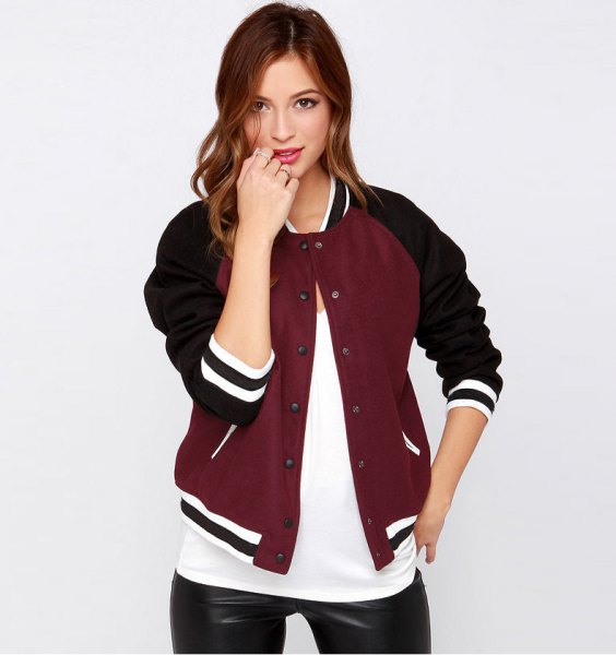 black and burgundy casual baseball jacket with white tee and leather leggings