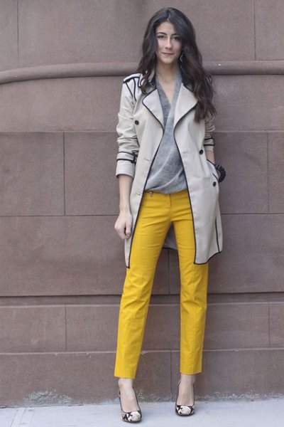 light gray trench coat with yellow ankle trousers
