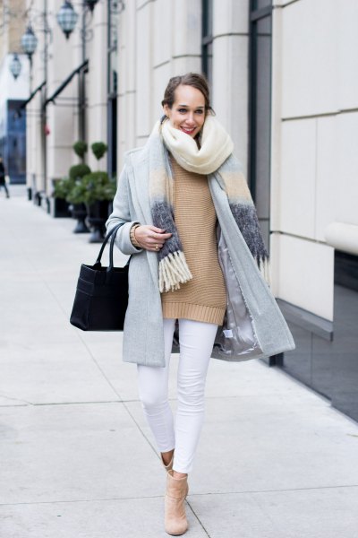 light gray cocoon coat with pink sweater and white cropped jeans