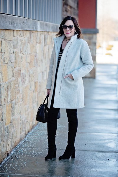 light gray cocoon coat with black and white striped tank top