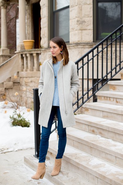 light gray long jacket with sky blue sweater and skinny jeans