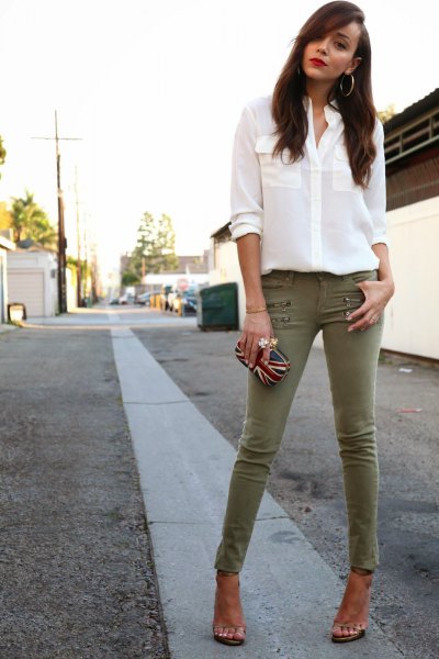 white chiffon button blouse with olive skinny pants
