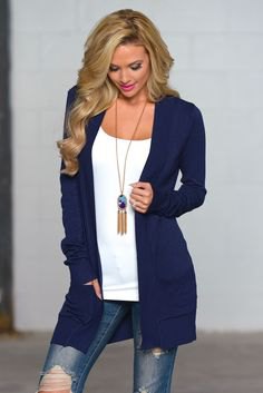 navy blue cardigan with white top with shoe neck and boho necklace