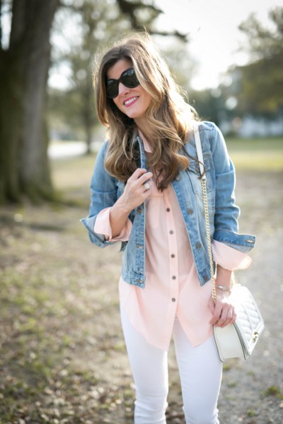 blue denim jacket with red silk blouse and white jeans