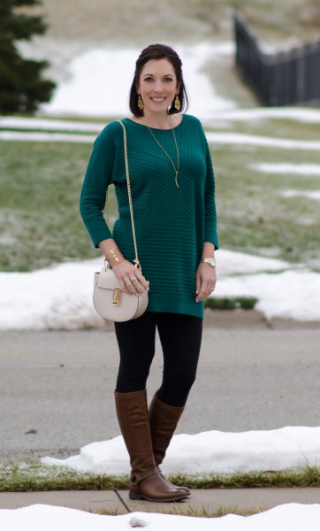 long sleeved striped sweater with black leggings and brown leather shoes