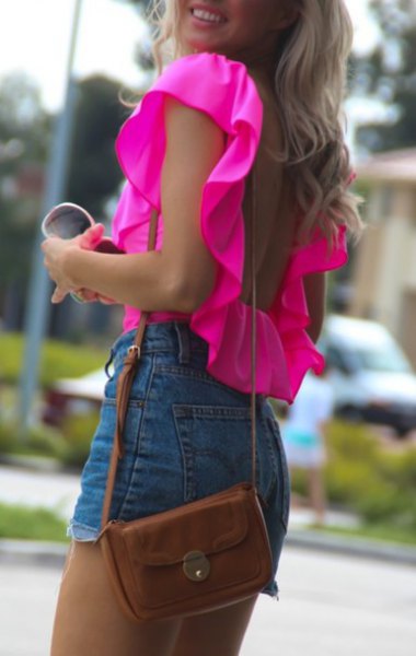 warm pink ruffle shoulder sleeveless blouse with high-rise denim shorts