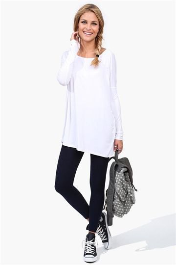 white tunic long sleeve tee with black ankle jeans