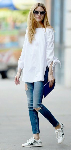 white from the shoulder long blouse with ripped ankle jeans
