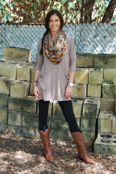 gray dress with tunic with leggings and knee-high boots in brown leather