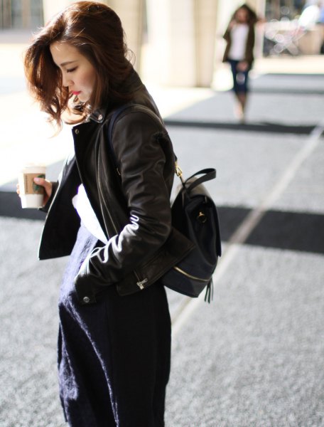 black bomber jacket with navy blue midi shift dress with backpack