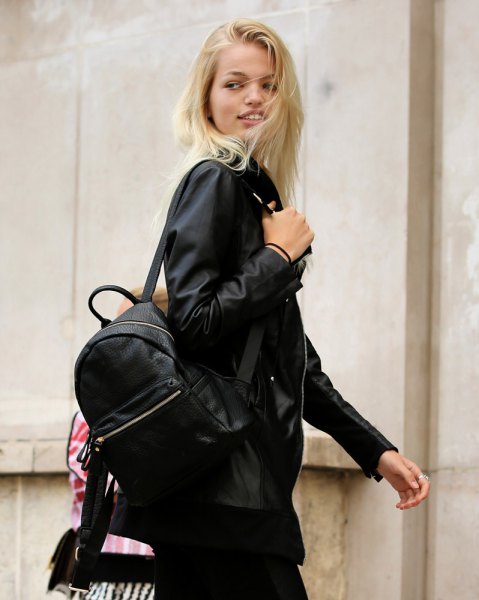 black bomber jacket with backpack and slim jeans