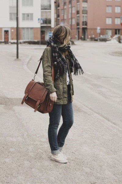 military jacket with black checkered scarf and brown suede bag