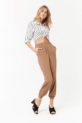 gray and white vertical striped buttoned up shirt with green pants