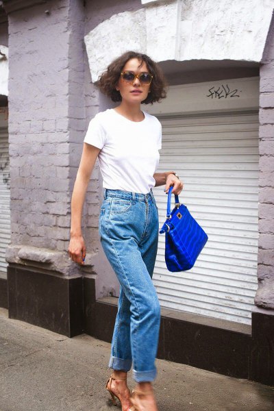 white tee with mom jeans and blue handbag