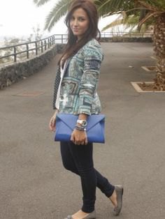 gray printed blazer with blue leather clutch bag