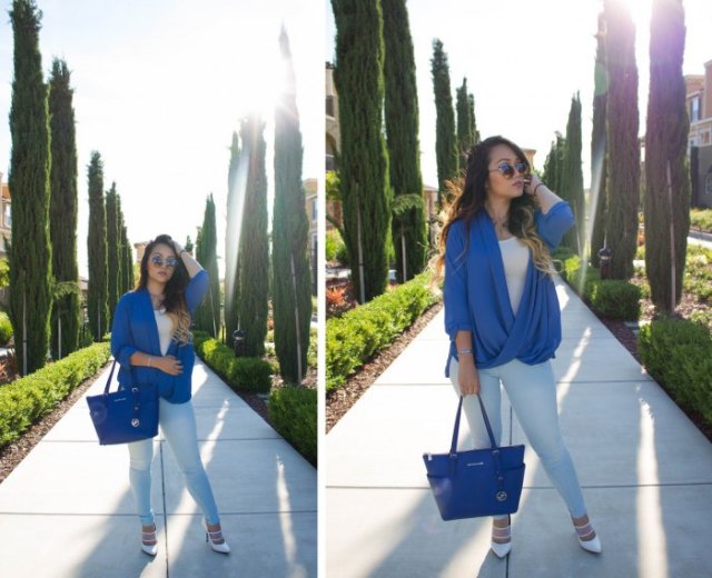royal blue leather bag with matching draped top and white jeans
