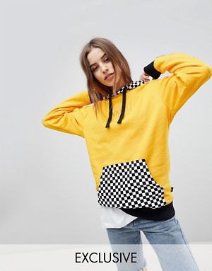 mustard yellow and checkered hoodie with blue jeans