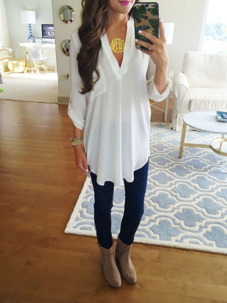 white tunic v-top with gray suede ankle shoes