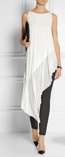 white sleeveless high low tunic blouse with black skinny jeans
