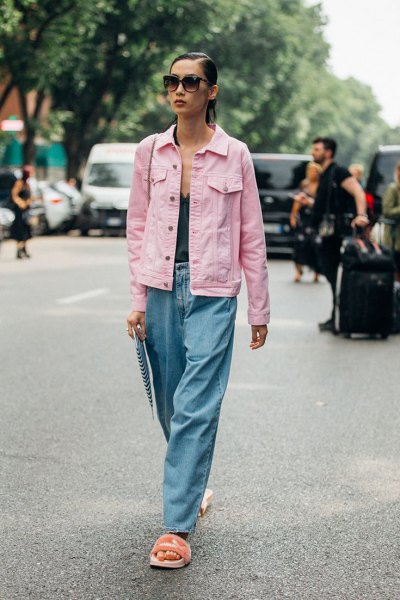 light pink denim jacket with black deep v-top with top and jeans with wide leg