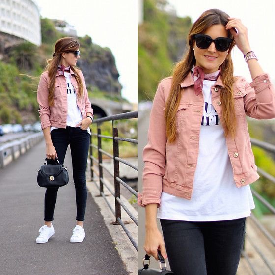 pink denim jacket with white print tee and black skinny jeans