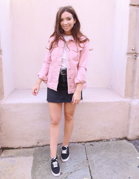 light pink denim jacket with white tee and black denim skirt