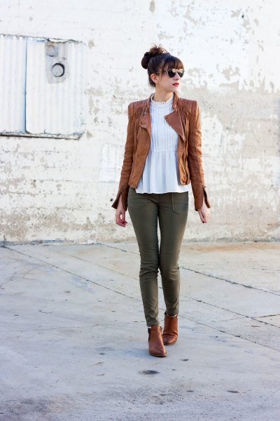 tank leather jacket with white peplum top and gray jeans