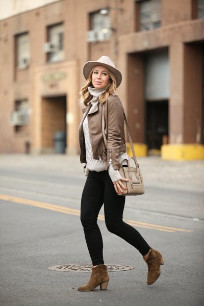 leather jacket with gray sweater neck shirt and white felt hat