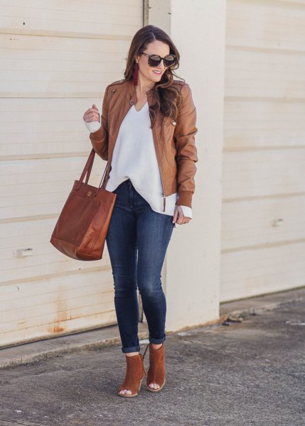 leather jacket with white v-neck blouse and camel boots with open toe