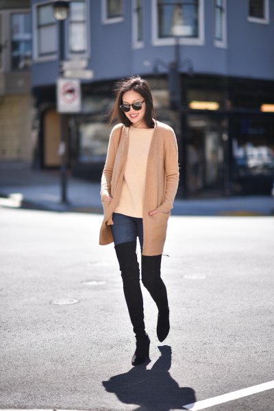 pink pink long jacket with blue high jeans and black thigh high boots