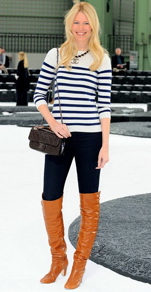 black and white striped knit sweater with long jeans and orange boots