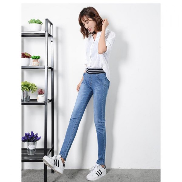 white half-warm blouse with blue high waist jeans