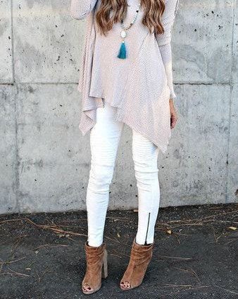 light gray knitted tunic top with white jeans with zipper