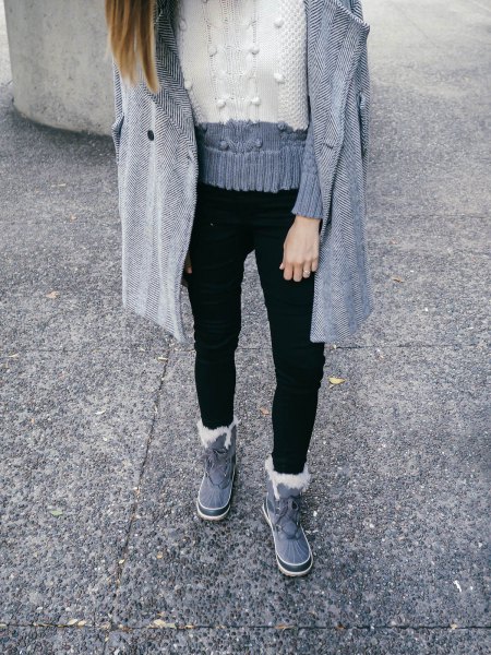 gray and white color blocks knitted sweater with black jeans