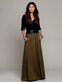 black scoop neck blouse with belt maxi green skirt