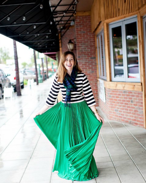 black and white striped three-sleeve tee with green pleated maxi skirt