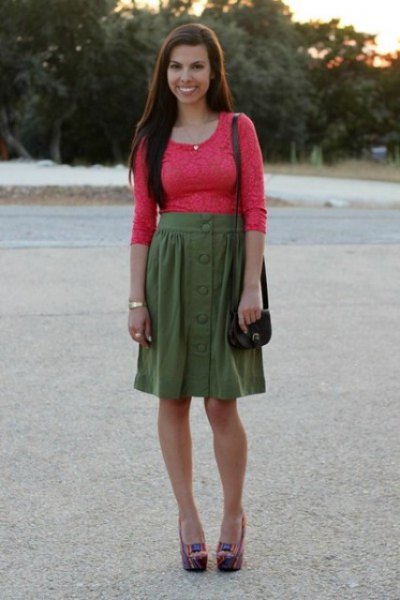orange molded half sleeve lace top with green knee length skirt