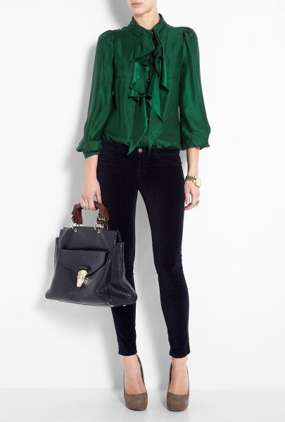 green ruffle blouse with black skinny jeans