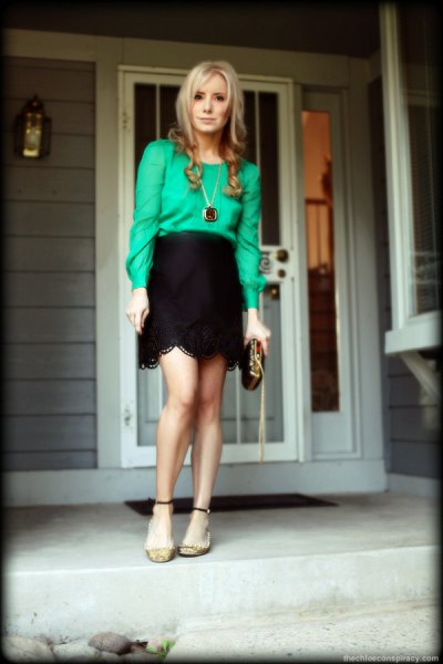 buttonless blouse with black high waist in peeled mini skirt