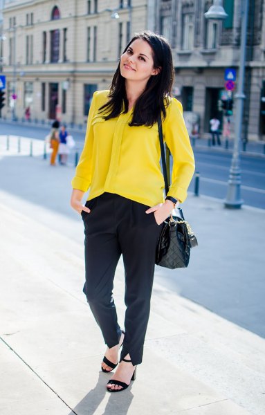 yellow button up shirt with black chinos and heeled sandals