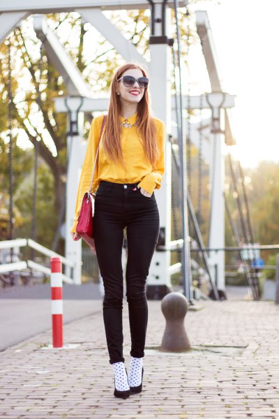 yellow button up shirt with black high skinny jeans