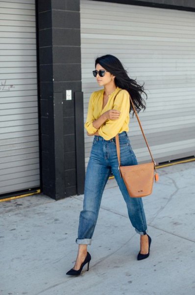 yellow shirt with cuffed washed mom jeans