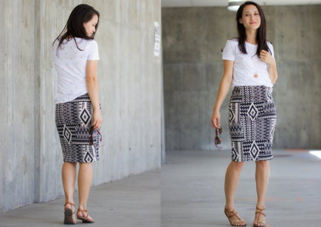 white tee with black and white stem printed knee length knit skirt