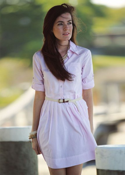 pale pink buttoned up with belt mini dress with silver statement necklace