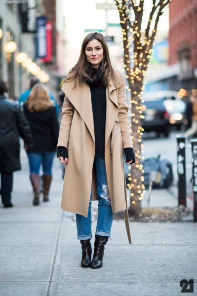 maxi camel long-line jacket with black sweater and cuffed jeans
